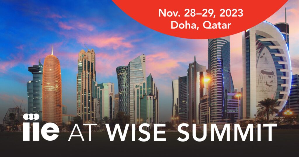 text reading "IIE at WISE Summit" sits in front of photo of the skyline of Doha, Qatar.