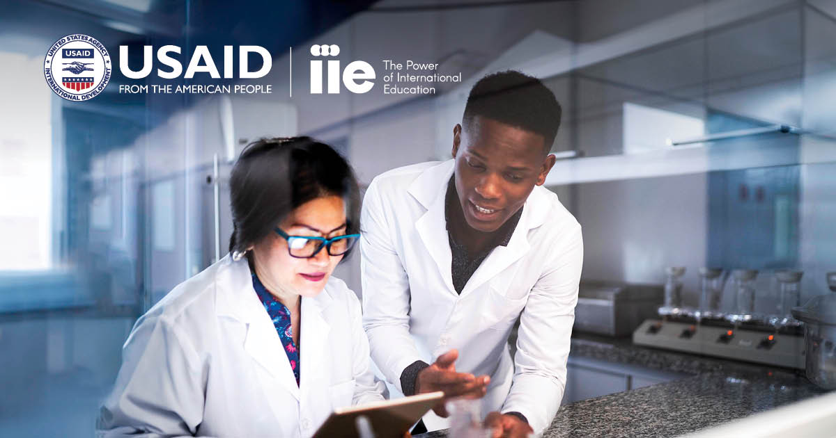 USAID SPARK Hero image showing two students in lab jackets