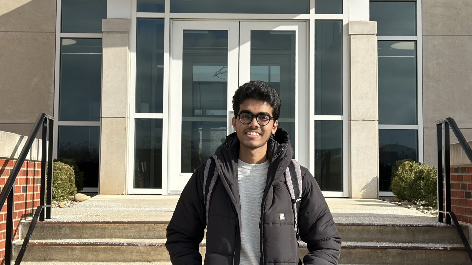 ESF grantee, Taseen Iqtider of Bangladesh is pictured in front of a Tennessee Tech University campus building. He is able to continue his studied there withe the support from the Emergency Student Fund