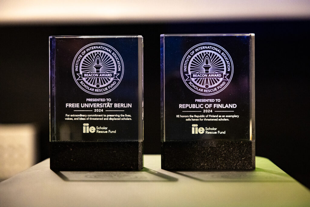 Glass plaques name Finland and Freie Universität Berlin as 2024 IIE-SRF Beacon Award recipients.